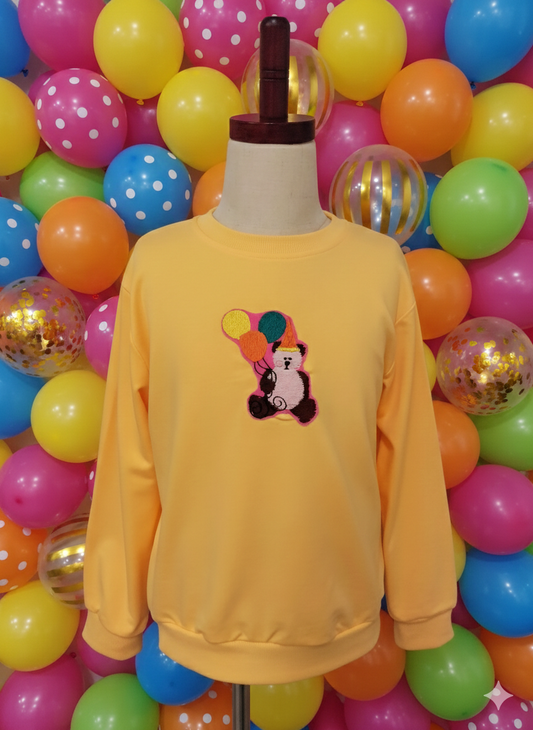 Jersey amarillo con parche bordado de osito de fiesta